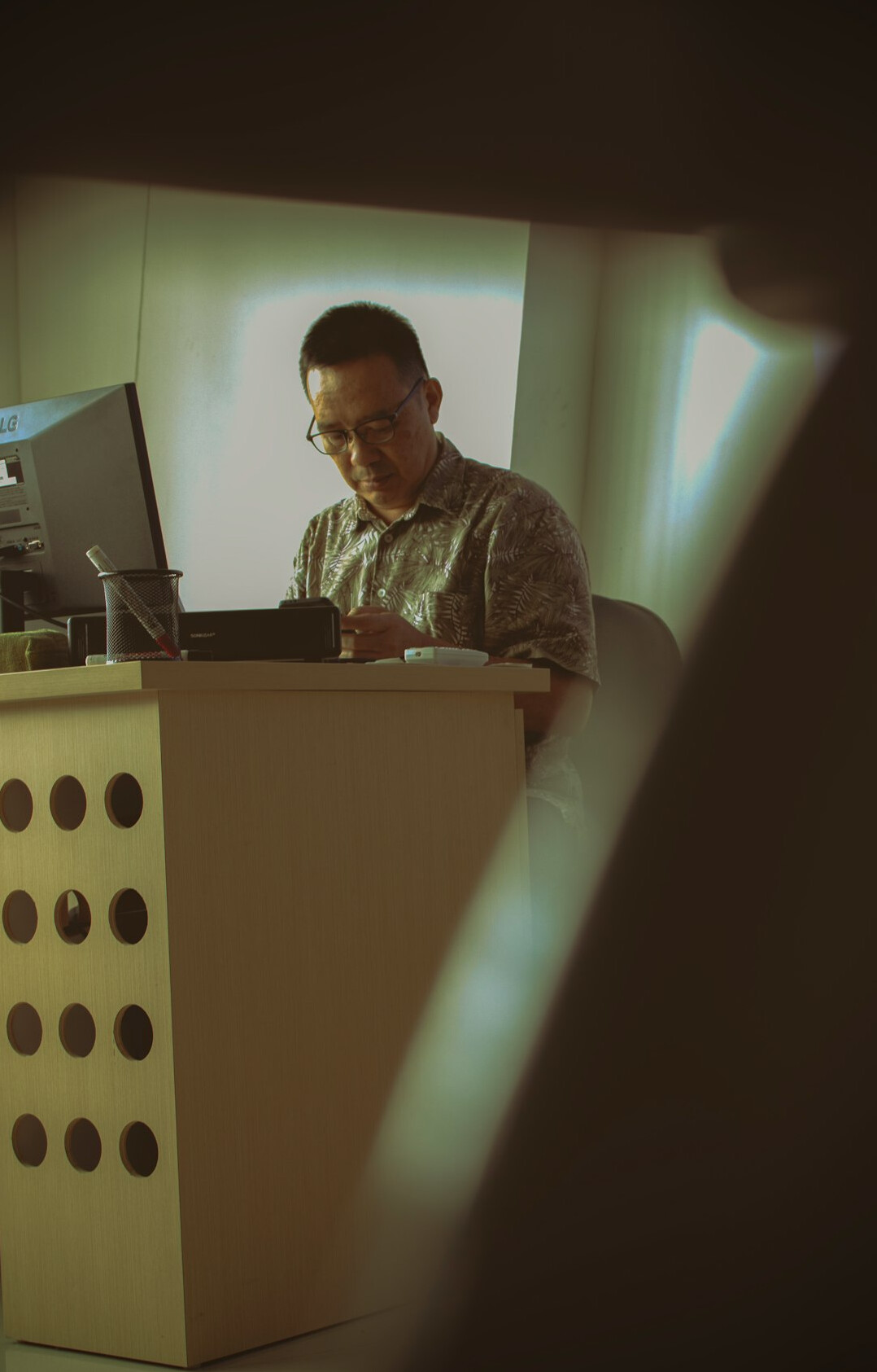 japanese programmer at desk