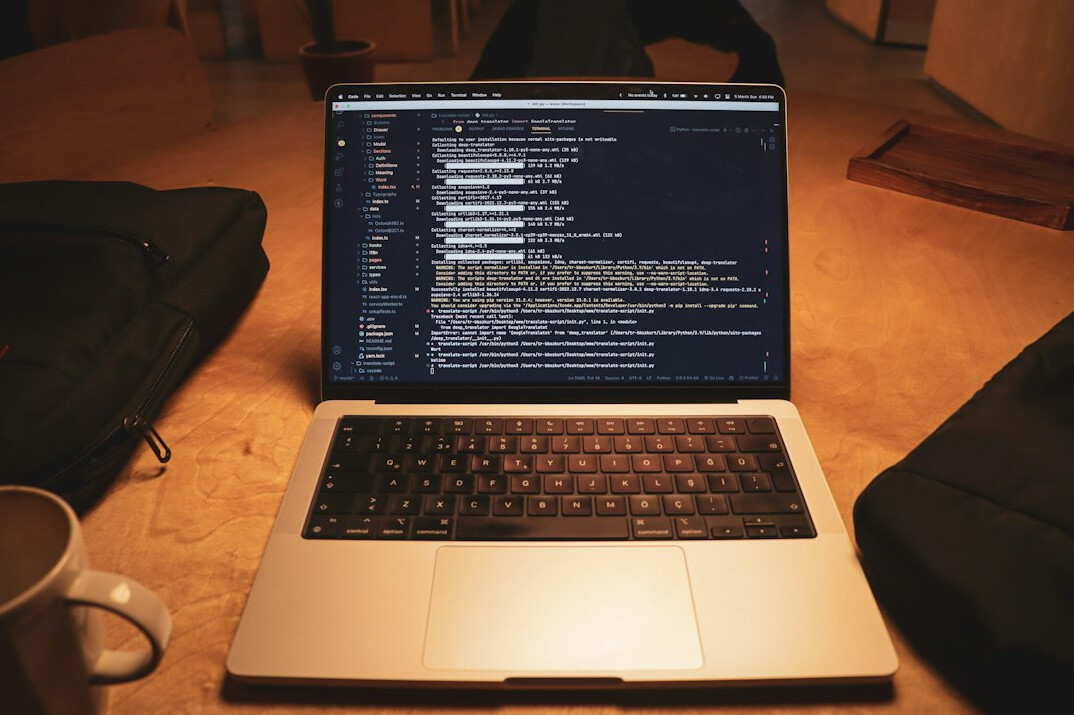 laptop with code and notes